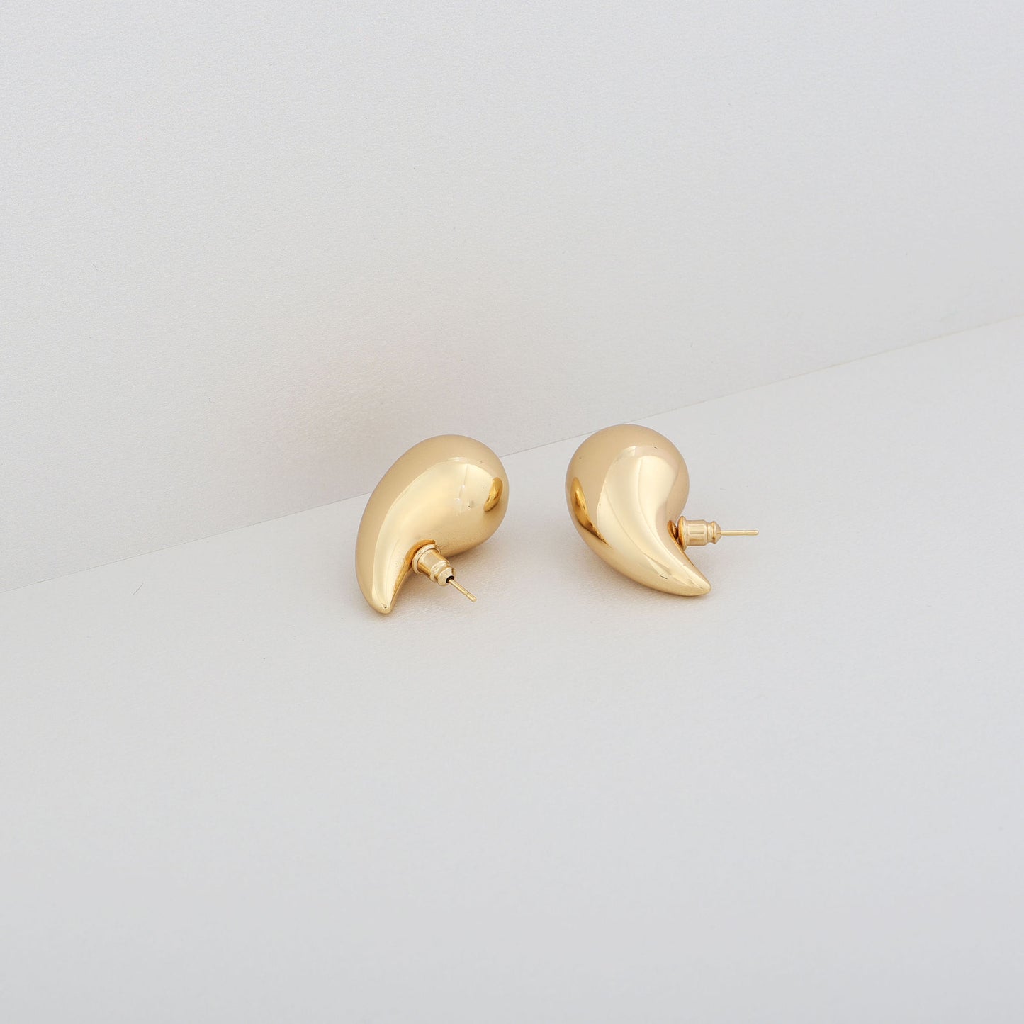 Stylish and minimalist dome earrings in gold or silver