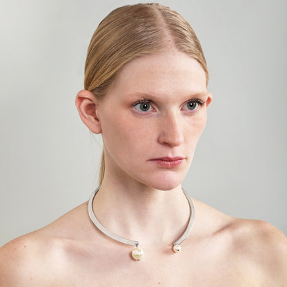 A silver choker necklace adorned with pearls can be a beautiful and versatile accessory.