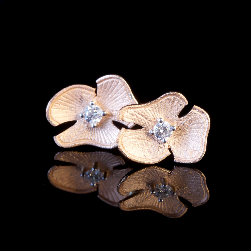 orchid diamond earrings with yellow gold and diamond in the center 