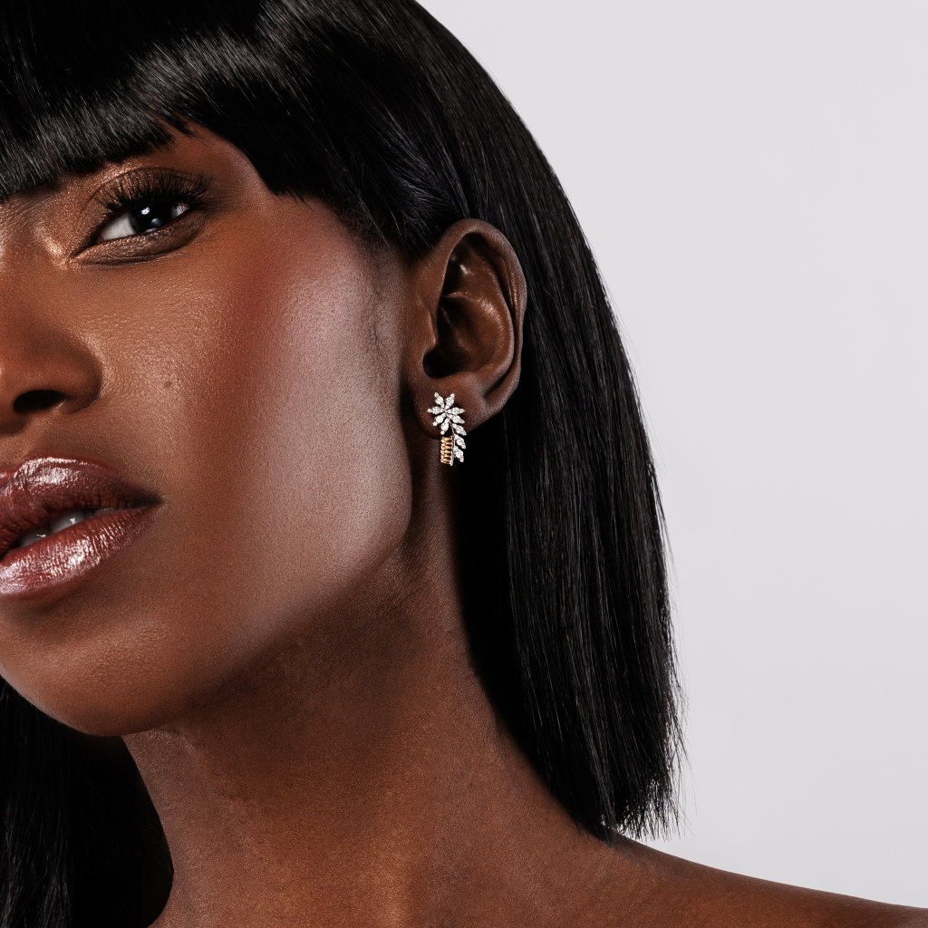 beautiful gold diamond earrings on model
